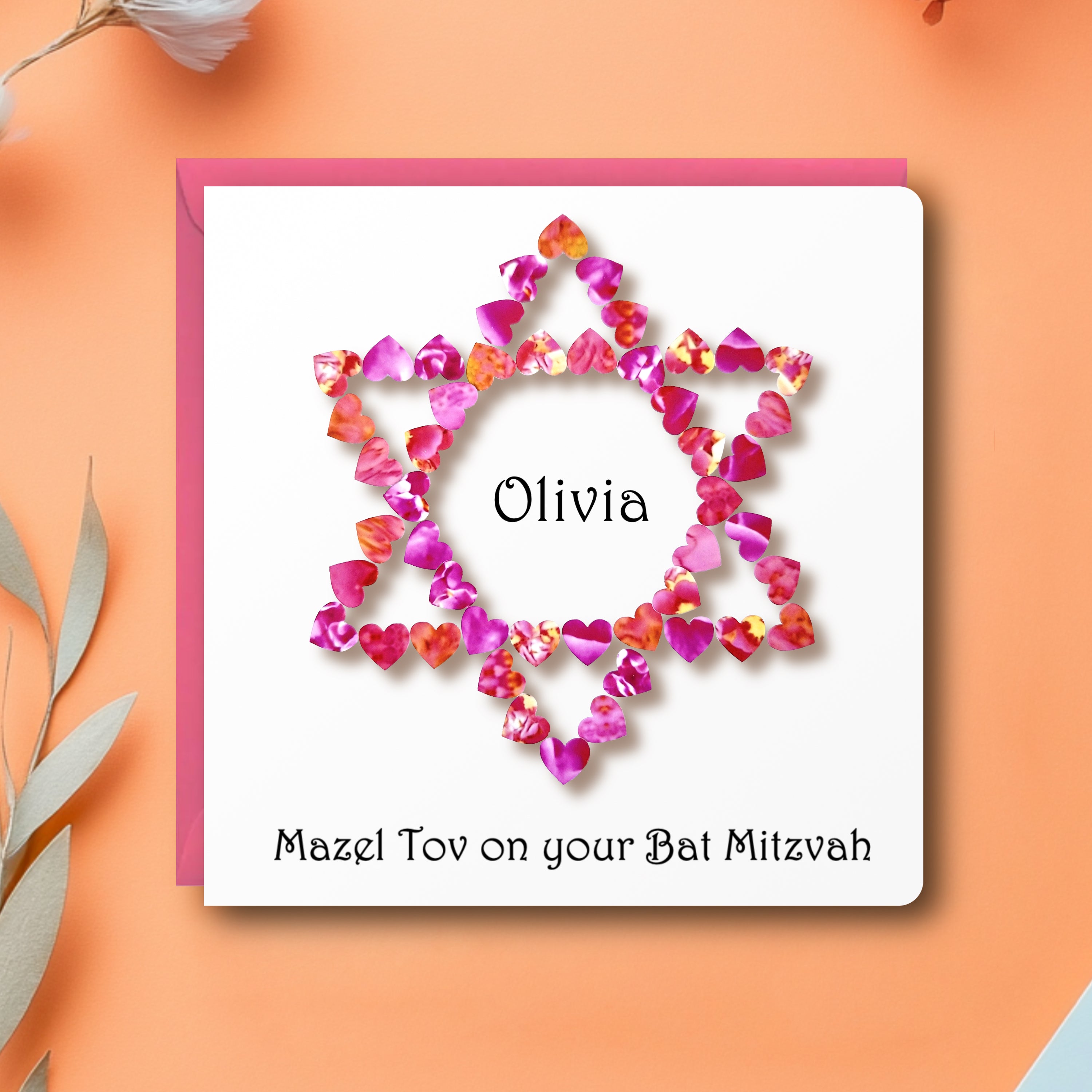 Personalised Bat Mitzvah Card with a star of david made up from small pink hearts and the text 'Mazel Tov on your Bat Mitzvah' printed on the front, with a pink envelope on a pale orange background