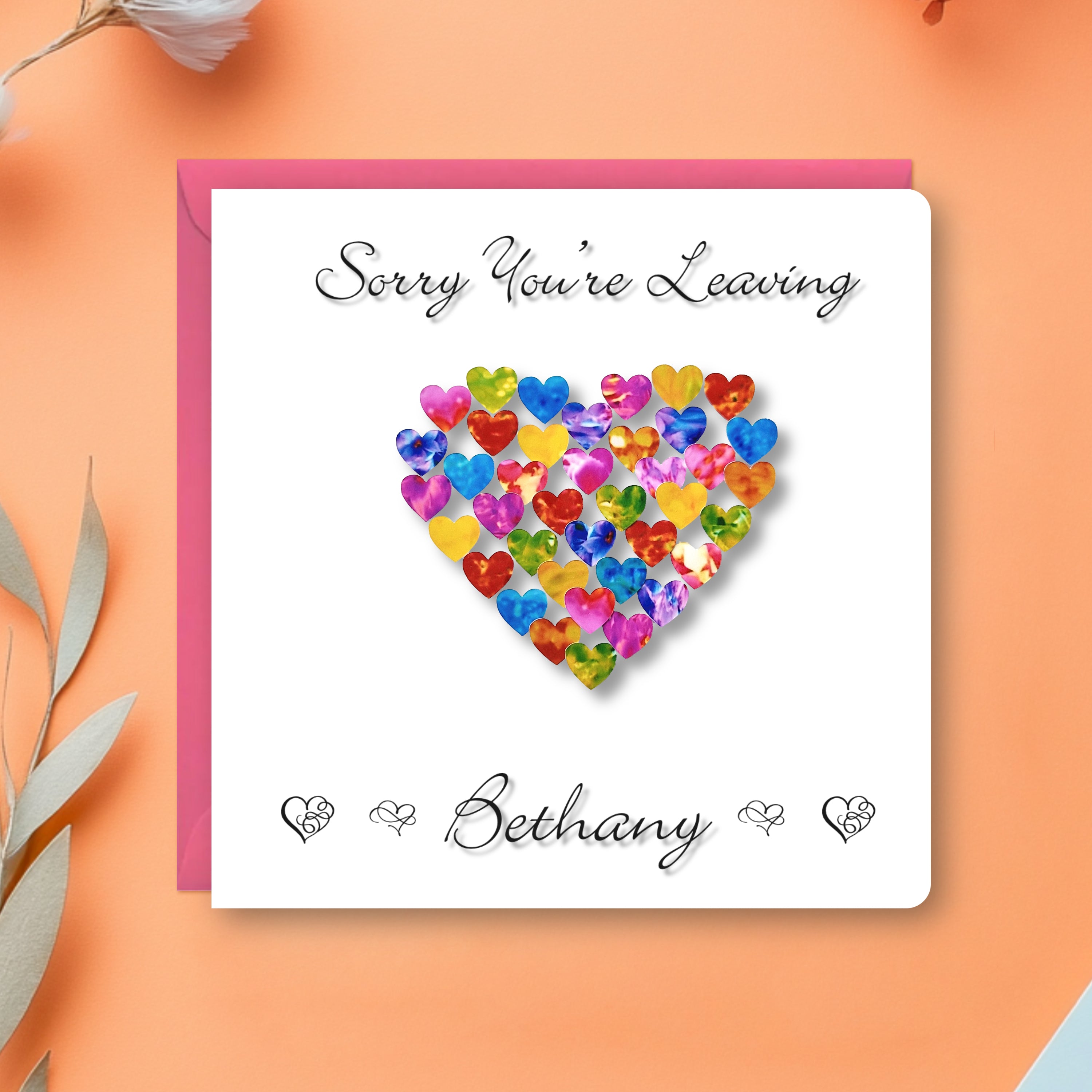 Personalised Sorry You're Leaving Card with colourful hearts in a design, with a pink envelope on an orange background